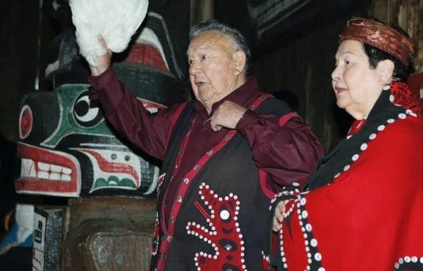 The keeper of hundreds of Kwakwaka’wakw songs, Kwaksistalla Wathl’thla (Clan Chief Adam Dick), chanting at a feast (qui’las) with Mayanilh (Dr. Daisy Sewid-Smith).