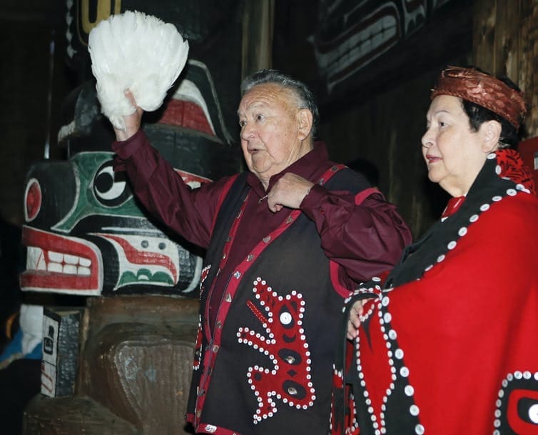 The keeper of hundreds of Kwakwaka’wakw songs, Kwaksistalla Wathl’thla (Clan Chief Adam Dick), chanting at a feast (qui’las) with Mayanilh (Dr. Daisy Sewid-Smith).